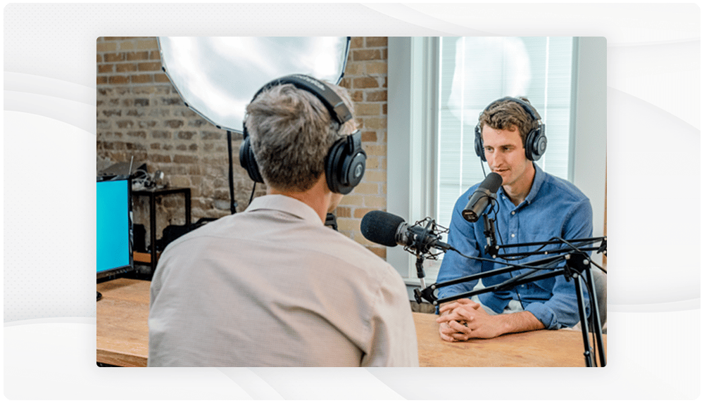 Podcast host recording an episode to spread the word about an upcoming event