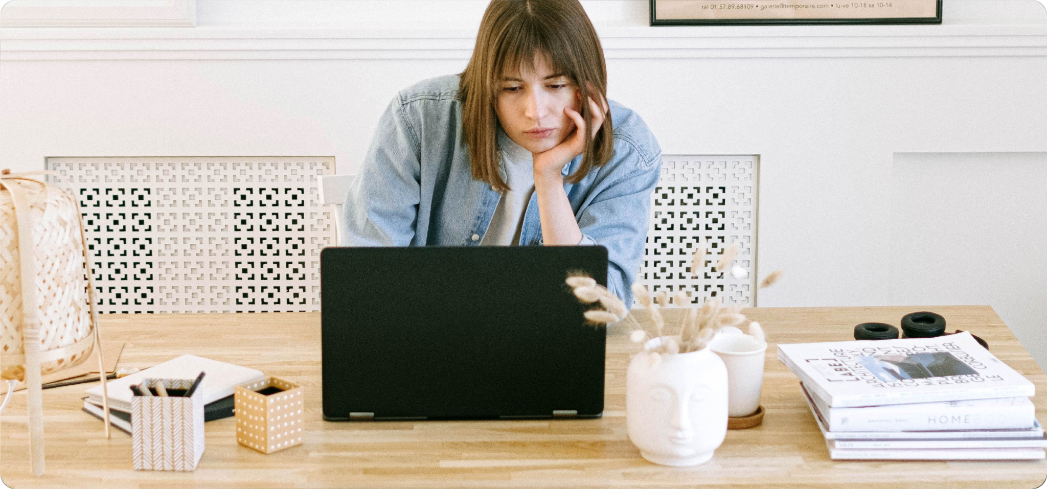 Online attendee joining a hybrid event remotely from home